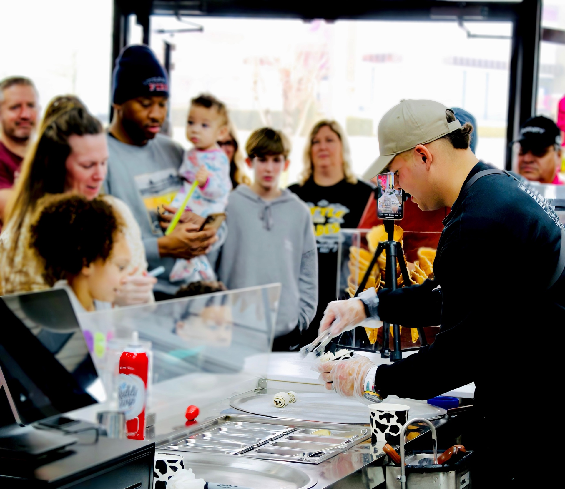 Cole serving customers behind the counter
