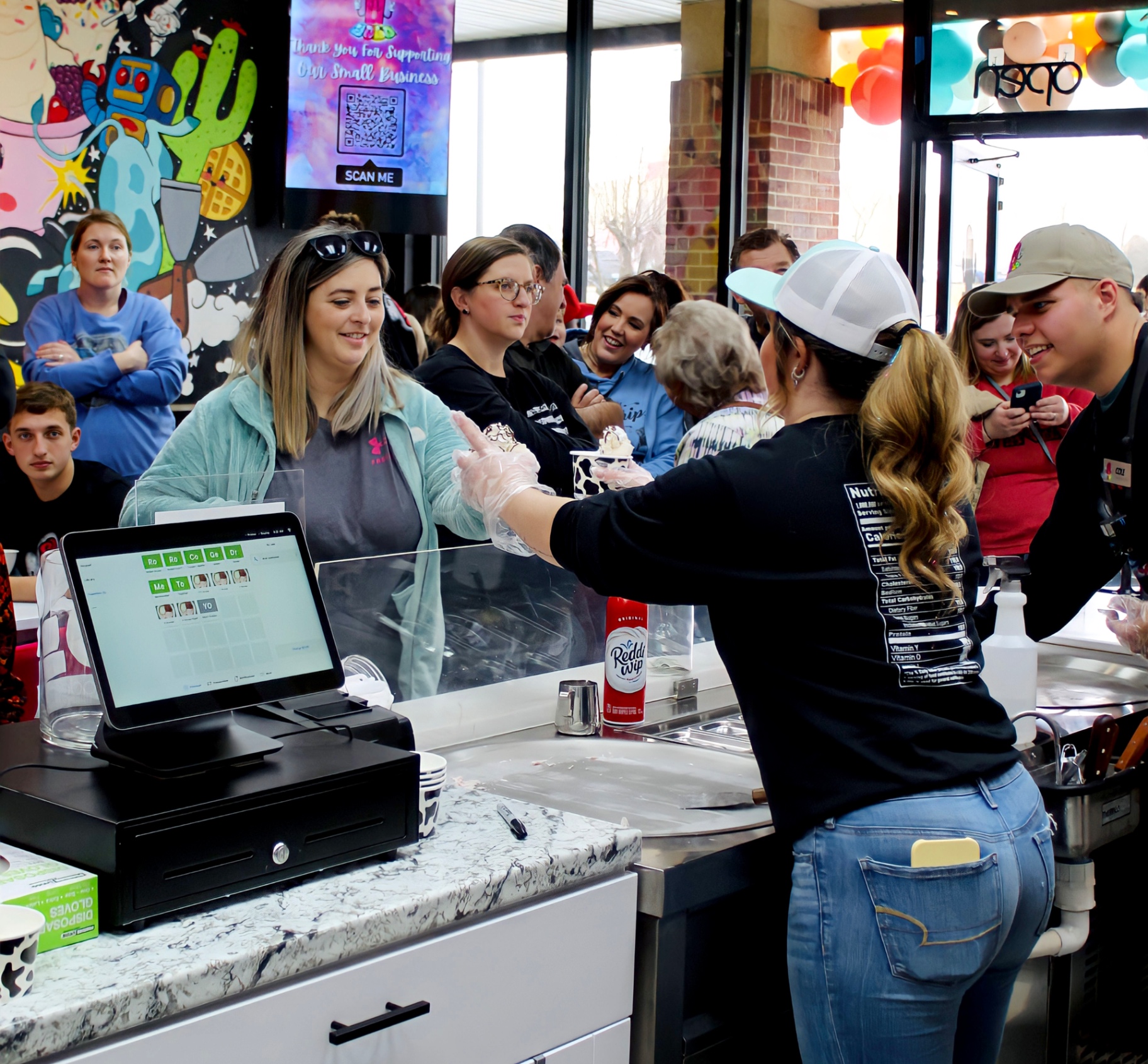 Neighbors lined up at the counter of the Crutcher family shop